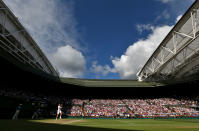 Andy Murray, who will be representing Great Britain in this month’s Summer Games, hits a forehand shot during his Gentlemen's Singles semi final match against Jo-Wilfried Tsonga of France on day eleven of the Wimbledon Lawn Tennis Championships at the All England Lawn Tennis and Croquet Club on July 6, 2012 in London, England. (Photo by Paul Gilham/Getty Images)