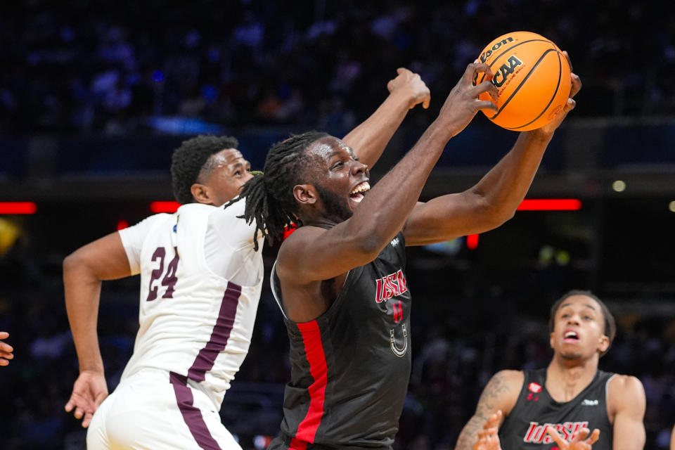 Winston-Salem State forward Imajae Dodd (44) grabs a rebound in front of Virginia Union guard Tahj Harding (24) during the second half of the HBCU Classic NCAA college basketball game in Indianapolis, Saturday, Feb. 17, 2024. (AP Photo/Michael Conroy)