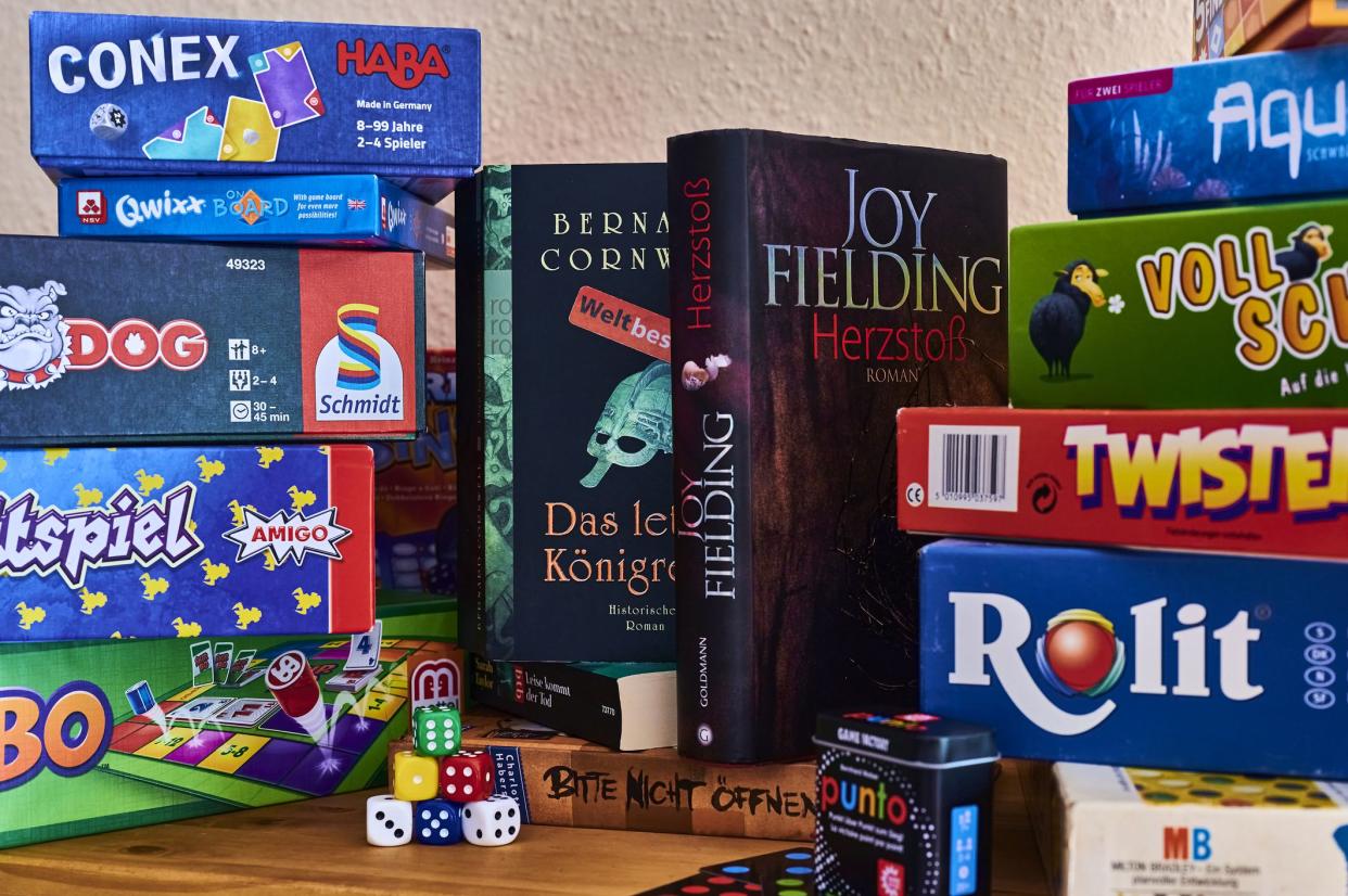 Berlin, Germany - September 6, 2020: Books and many different packs of board games.