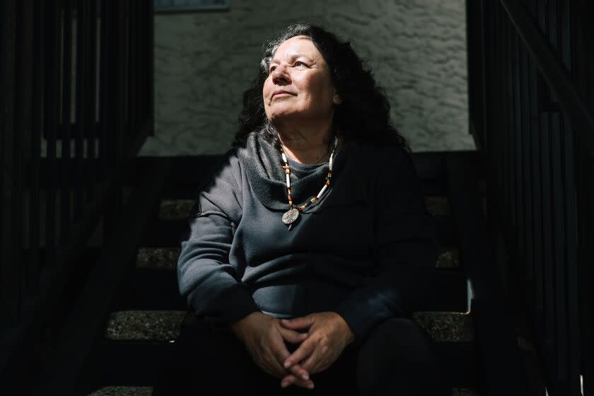 Placentia, CA - March 30: Susan Bustamante, a member of the California Coalition for Women Prisoners, served 31 years in prison for a domestic violence case and here poses for a portrait at her apartment complex on Thursday, March 30, 2023 in Placentia, CA. New legislation would allow judges and juries to consider domestic violence and human trafficking in cases where the victim of those crimes is charged with a crime. (Dania Maxwell / Los Angeles Times)