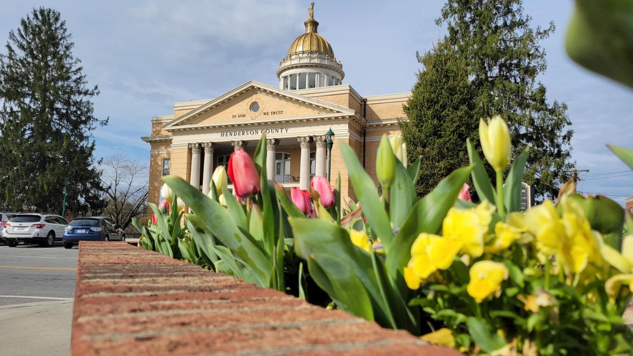 Tulips and other flowers are in full bloom along Main Street in downtown Hendersonville on Tuesday, March 29, 2022.