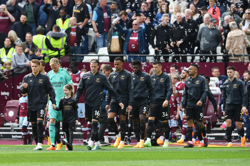 LONDON, ENGLAND - APRIL 16: Martin Odegaard of Arsenal leads teammates onto the pitch prior to the Premier League match between West Ham United and Arsenal FC at London Stadium on April 16, 2023 in London, England. (Photo by David Price/Arsenal FC via Getty Images)