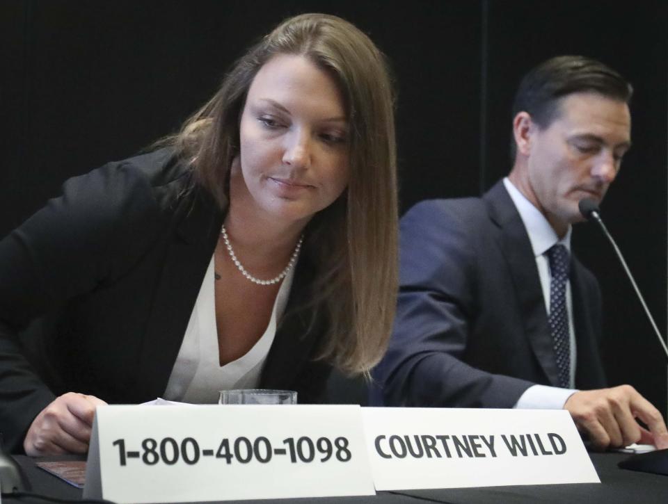 Courtney Wild, left, joined by her attorney Brad Edwards, leaves after reading a statement a news conference, calling on victims of Jeffrey Epstein to contact the FBI or lawyers with their information, Tuesday, July 16, 2019, in New York. (AP Photo/Bebeto Matthews)