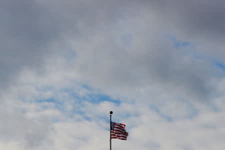 A U.S. flag flies over Massachusetts Institute of Technology (MIT) in Cambridge, Massachusetts, U.S., November 21, 2018. REUTERS/Brian Snyder