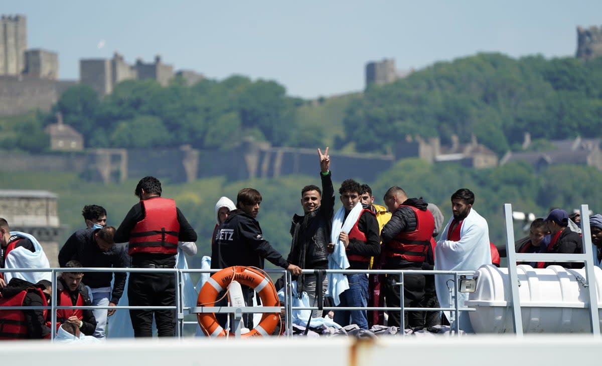 A group of people thought to be migrants are brought in to Dover (PA) (PA Wire)