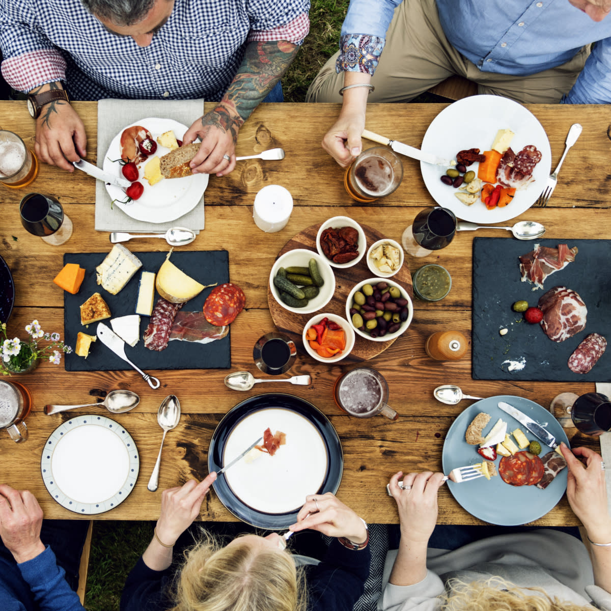 People eating food on a dinner table