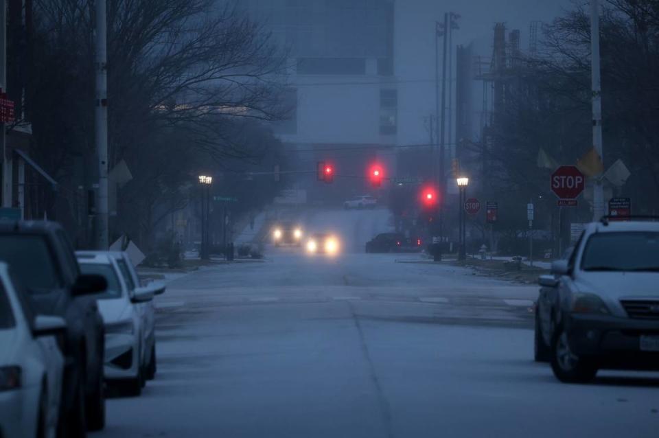 Icy precipitation gathers covers 5th Street on Tuesday morning, January 31, 2023, in Fort Worth. The winter storm warning is extended through 6 a.m. Thursday and freezing rain is expected most of Tuesday and Wednesday, officials said.