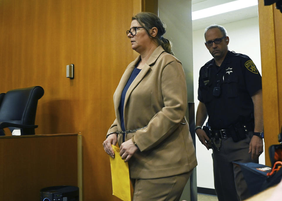 Defendant Jennifer Crumbley enters the courtroom for trial at Oakland County Courthouse, Tuesday, Jan. 30, 2024, in Pontiac, Mich. Crumbley, 45, is charged with involuntary manslaughter. Prosecutors say she and her husband were grossly negligent and could have prevented the four deaths if they had tended to their son’s mental health. They’re also accused of making a gun accessible at home. (Clarence Tabb Jr./Detroit News via AP)