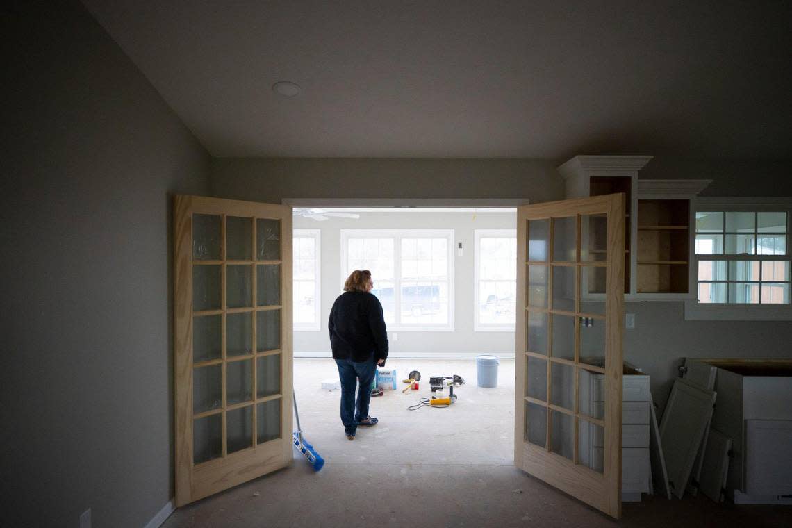Margaret Whitmer stands inside her home that is under construction near Bremen, Ky., on Thursday, Feb. 2, 2023. A tornado on Dec. 10, 2021, destroyed Whitmer’s previous home on the site.
