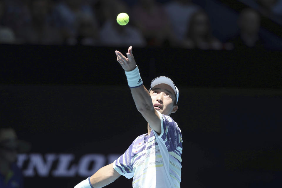 Japan's Go Soeda serves the ball to Martin Cuevas of Uruguay during their match at the ATP Cup in Perth, Australia, Saturday, Jan. 4, 2020. (AP Photo/Trevor Collens)