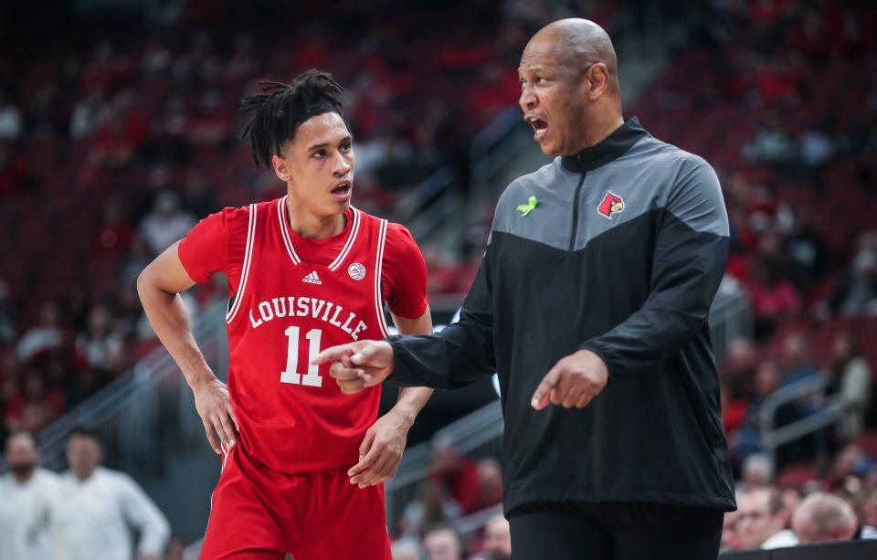 Louisville head coach Kenny Payne talks with Louisville guard Fabio Basili during the second half of the Cards' 71-54 loss to Virginia Tech. Feb. 28, 2023.