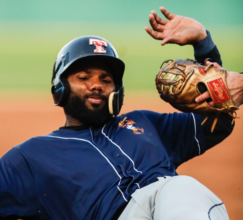 Toledo's Aderlin Rodriguez (46) is tagged out sliding into third base during the Indianapolis minor league baseball team home opener vs. Toledo on Tuesday, May 11, 2021, at Victory Field.