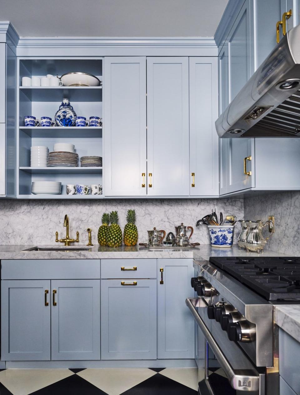 small kitchen blue cabinetry marble backsplash new york city nick olsen