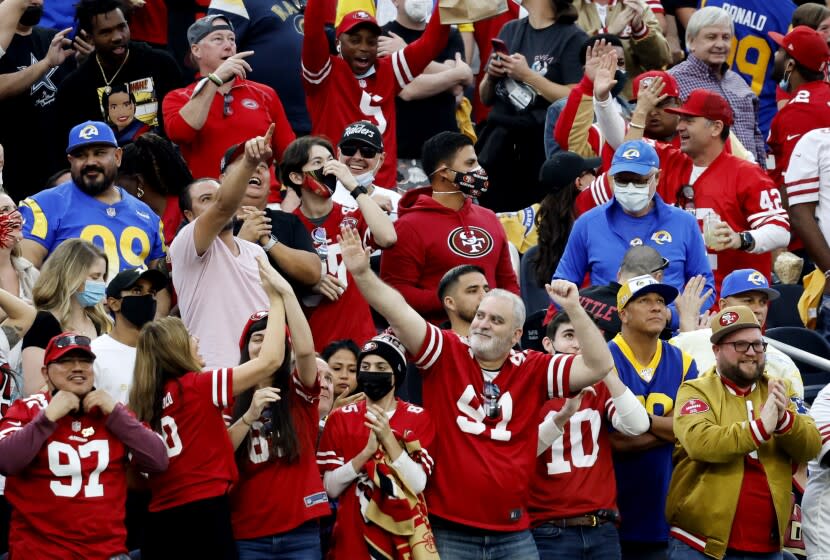 INGLEWOOD, CA - JANUARY 9, 2022: San Francisco 49ers fans cheer after the 49ers tied the game against the Rams in the second half on January 9, 2022 at SoFi Stadium in Inglewood, California.(Gina Ferazzi / Los Angeles Times)