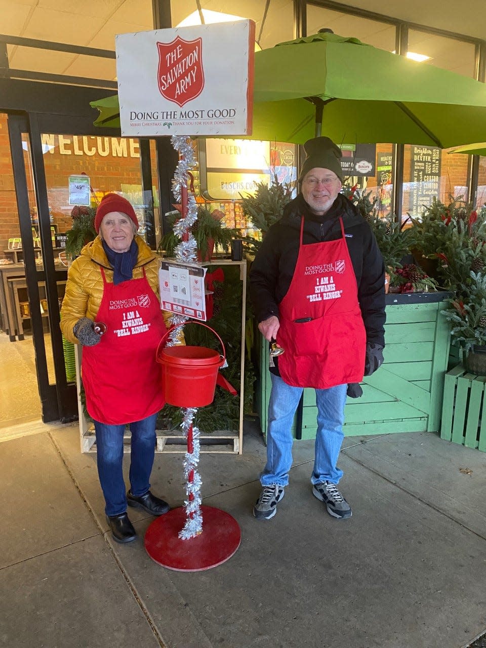 Jill Damon and Dave LaMoreaux, members of the Kiwanis Club of Ann Arbor, ring bells for the Salvation Army's Red Kettle campaign on Dec. 3 at a Busch’s store in Ann Arbor .