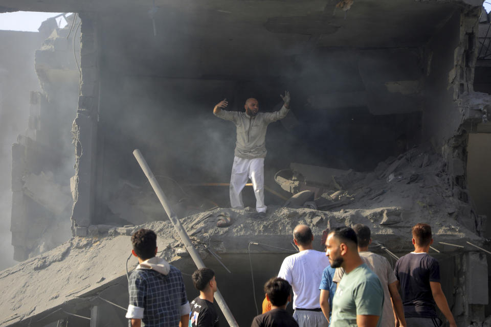 Palestinians look for survivors among the rubble of destroyed buildings following Israeli airstrikes on Jabaliya refugee camp on the outskirts of Gaza City, Tuesday, Oct. 31, 2023. (AP Photo/Abdul Qader Sabbah)