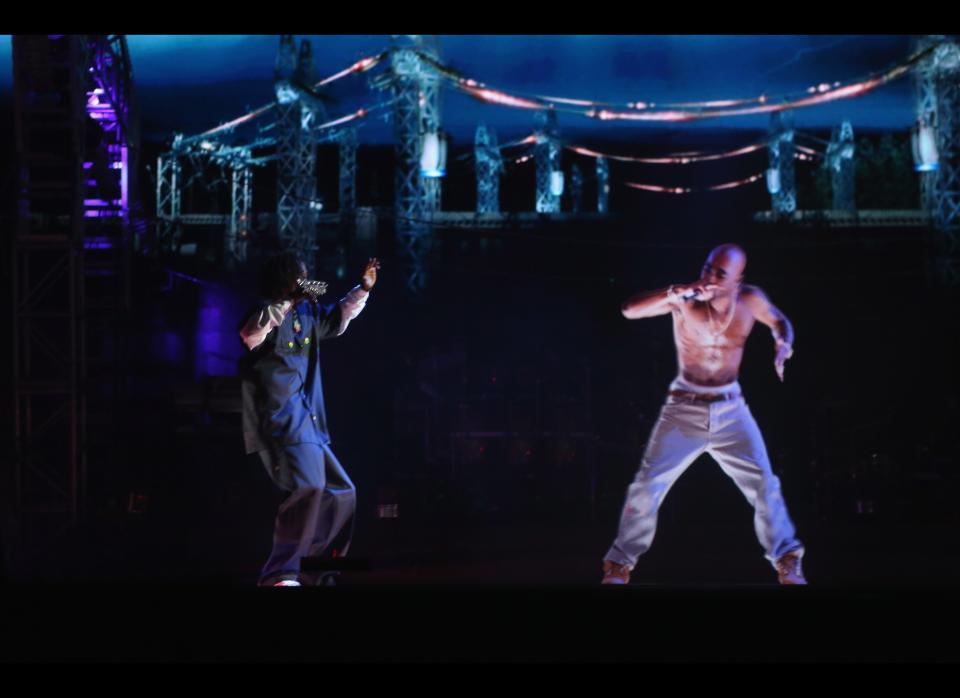 Rapper Snoop Dogg, left, and a hologram of deceased Tupac Shakur perform onstage during day 3 of the 2012 Coachella Valley Music & Arts Festival at the Empire Polo Field on April 15, 2012, in Indio, Calif.  