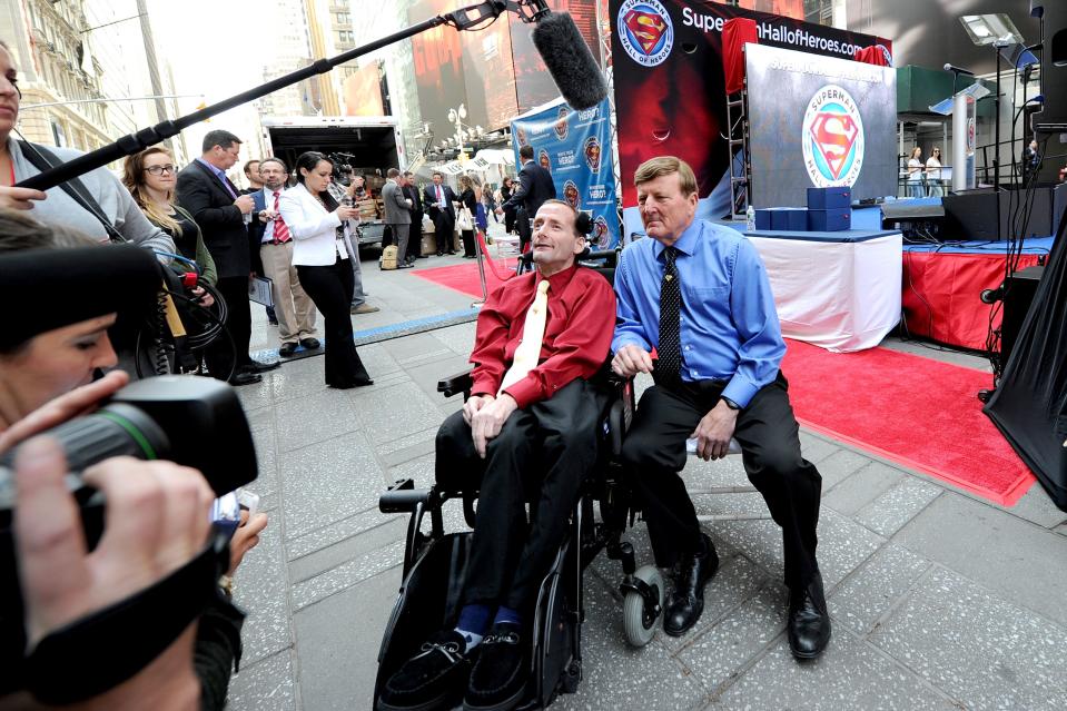NEW YORK, NY - MAY 13: Rick Hoyt (L) and Dick Hoyt participate in a media interview at Superman Hall Of Heroes inaugural event at Times Square on May 13, 2014 in New York City.  (Photo by Ilya S. Savenok/Getty Images for WBCP)