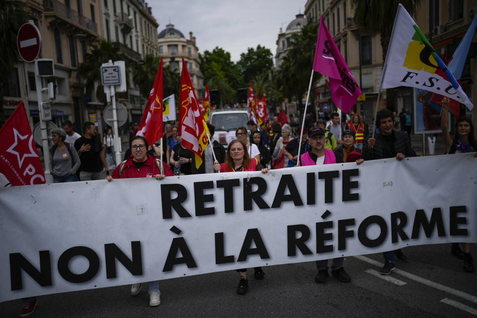 French union demonstrators protest President Emmanuel Macron's pension reform during the 76th edition of the Cannes Film Festival in Cannes, Sunday, May 21, 2023. (AP Photo/Daniel Cole)