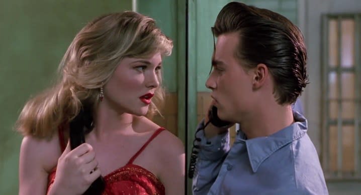 Two people look at each other in Cry-Baby.