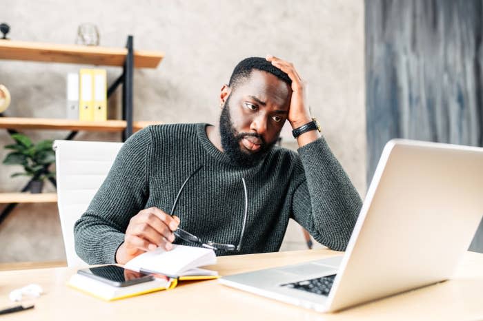 Man looking frustrated at his computer