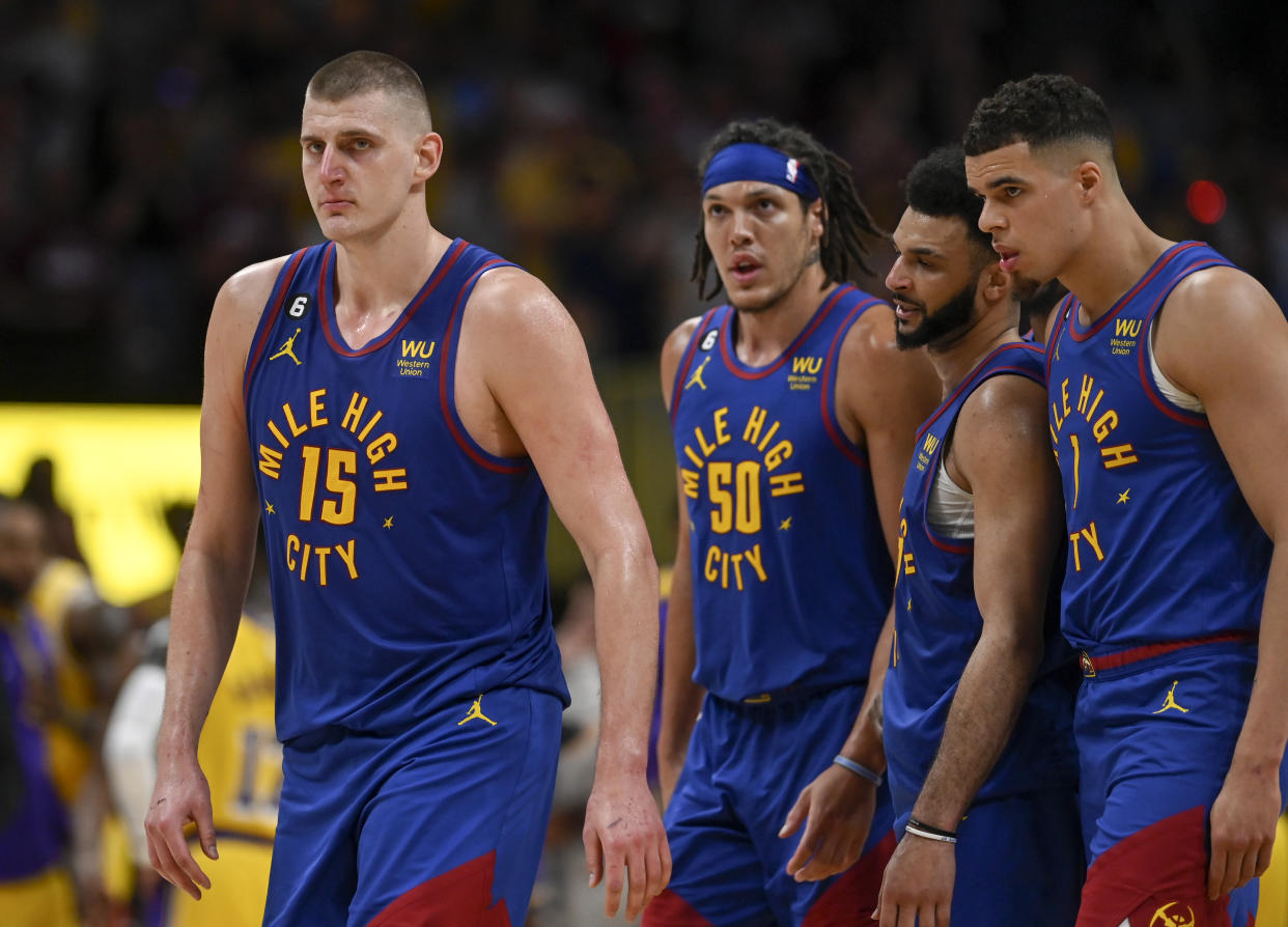 Denver's Nikola Jokić leads Aaron Gordon (50), Jamal Murray (27) and Michael Porter Jr. (1) toward the bench during the fourth quarter of Game 1 of the Western Conference finals at Ball Arena in Denver on May 16, 2023. (AAron Ontiveroz/The Denver Post)