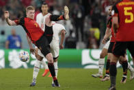 Belgium's Kevin De Bruyne fights for the ball during the World Cup group F soccer match between Belgium and Morocco, at the Al Thumama Stadium in Doha, Qatar, Sunday, Nov. 27, 2022. (AP Photo/Christophe Ena)