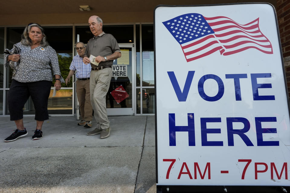 Voters depart an election center during primary voting, Tuesday, May 21, 2024, in Kennesaw, Ga. Conservative activists in Georgia and some other states are using a new software tool as part of a broader effort to scrub voters from the rolls. (AP Photo/Mike Stewart)