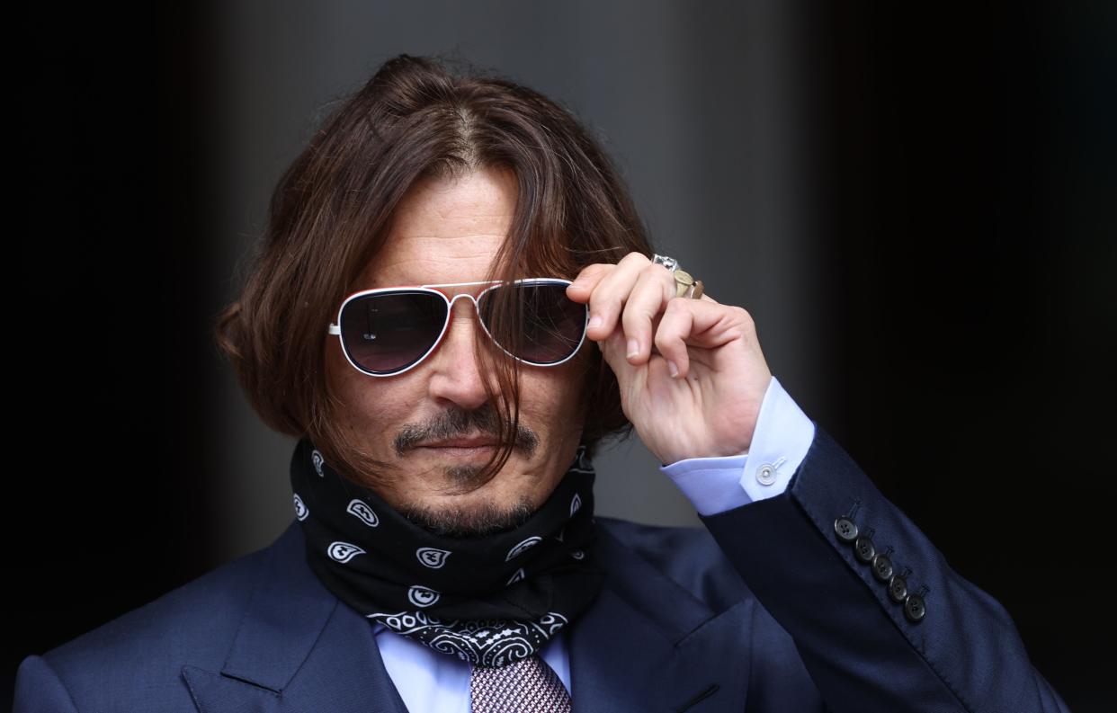 <p>Johnny Depp during his court case</p> (PA)