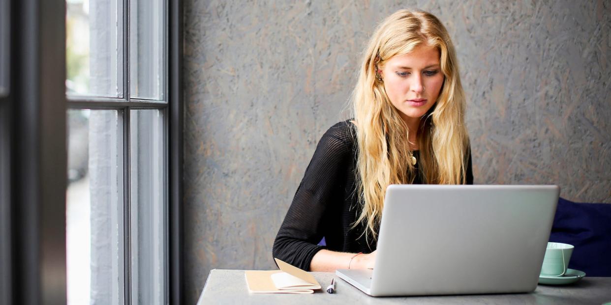 woman using laptop computer at office