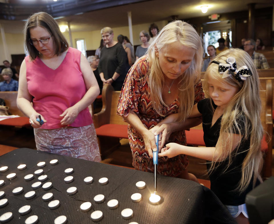 Candles are lit during a vigil at Fisk University to protest the execution of Billy Ray Irick Thursday, Aug. 9, 2018, in Nashville, Tenn. Tennessee carried out the execution of Irick, condemned for the 1985 rape and murder of a 7-year-old girl, marking the first time the state has applied the death penalty since 2009. (AP Photo/Mark Humphrey)