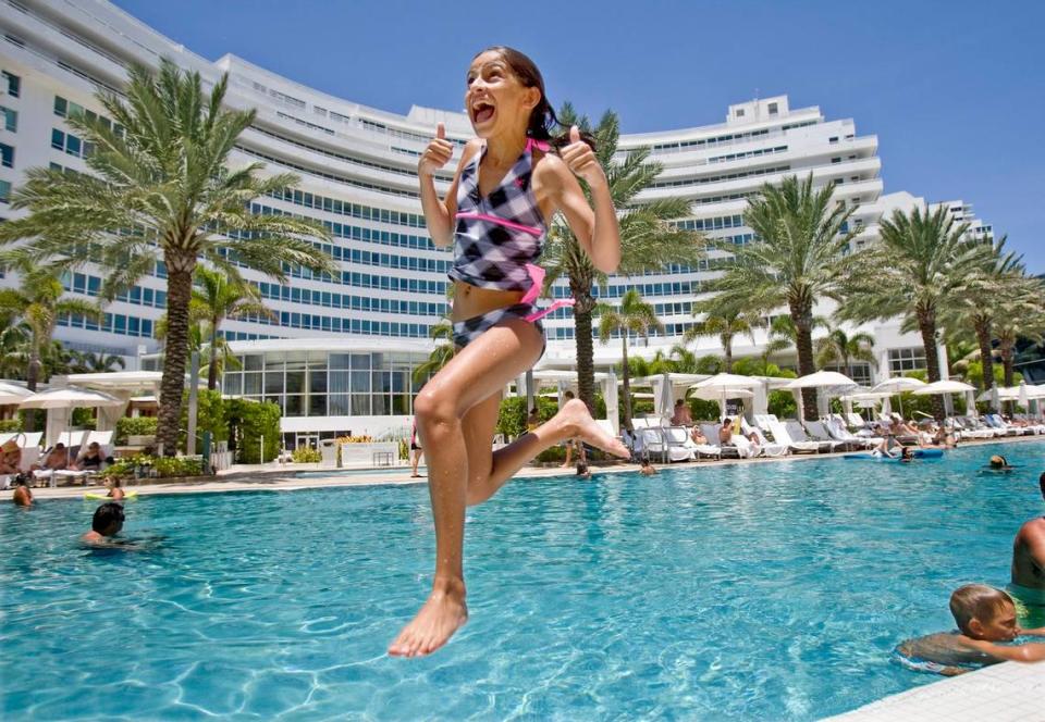 In 2010, 12-year-old Amanda Blanco of West Kendall jumps in the pool, while staying at the Fontainebleau Hotel on Miami Beach with the Flores families who are taking a short vacation across town.