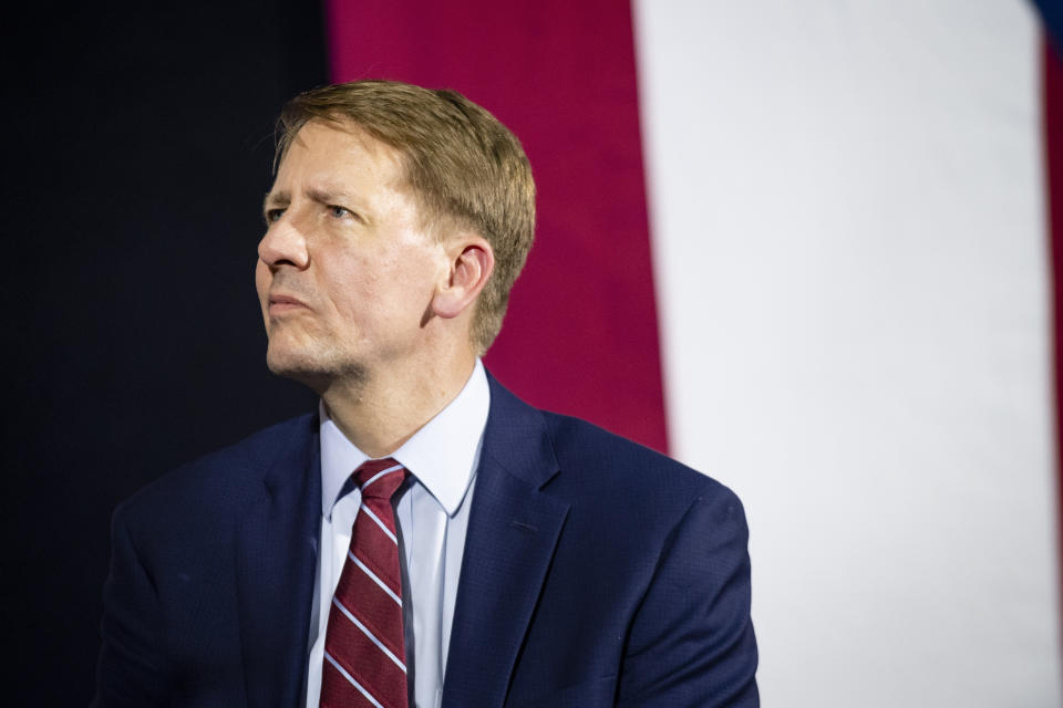 Richard Cordray listens while former President Barack Obama speaks during a campaign rally at CMSD East Professional Center Gymnasium on Sept. 13, 2018, in Cleveland, Ohio. (Photo: Angelo Merendino via Getty Images)