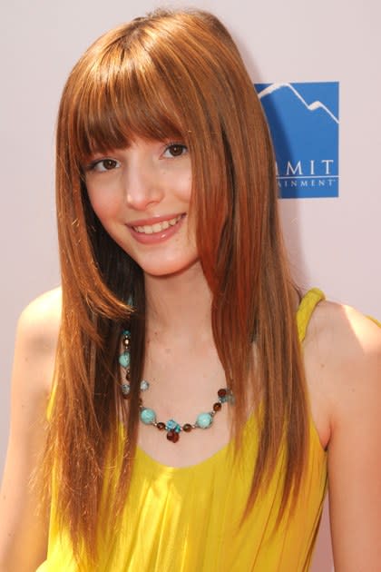 <p><strong>April 2010</strong></p> <p>The 13-year-old is sunny in a yellow dress, face-framing layers, and her signature bangs at the premiere of <em>Furry Vengeance.</em> Defined top lashes and simple, lightly glossed lips round out this red carpet-ready look.</p>