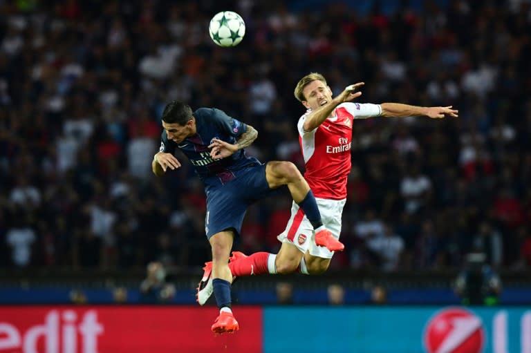 Paris Saint-Germain's Argentinian midfielder Angel Di Maria (L) vies with Arsenal's Spanish defender Nacho Monreal during the UEFA Champions League Group A football match between Paris-Saint-Germain vs Arsenal FC