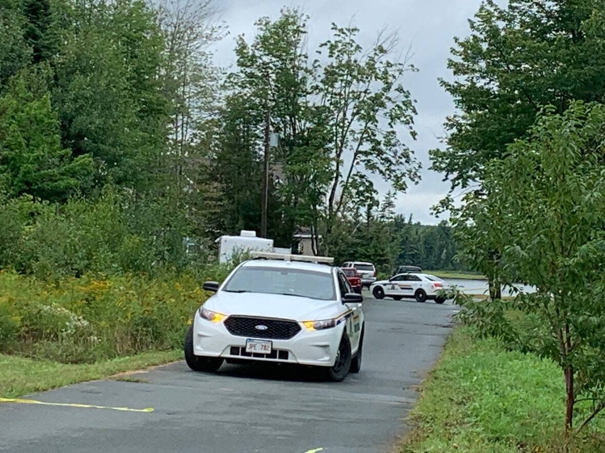 New Brunswick RCMP Major Crime Unit at the scene of the fatal stabbing of Christopher Dedam in August of 2020. (Gail Harding/CBC - image credit)