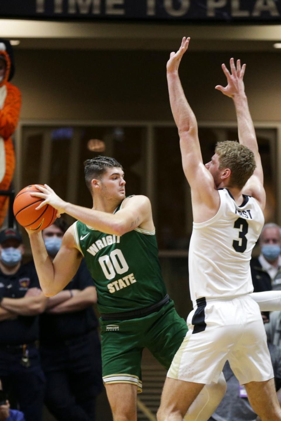 Purdue forward Caleb Furst (3) guards Wright State forward Grant Basile (00) during the first half of an NCAA men's basketball game, Tuesday, Nov. 16, 2021 at Mackey Arena in West Lafayette.