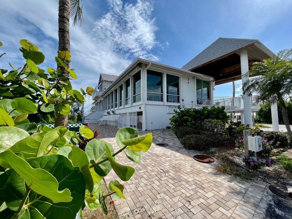 Floor to ceiling windows run along the dining room at The Green Flash on Captiva.