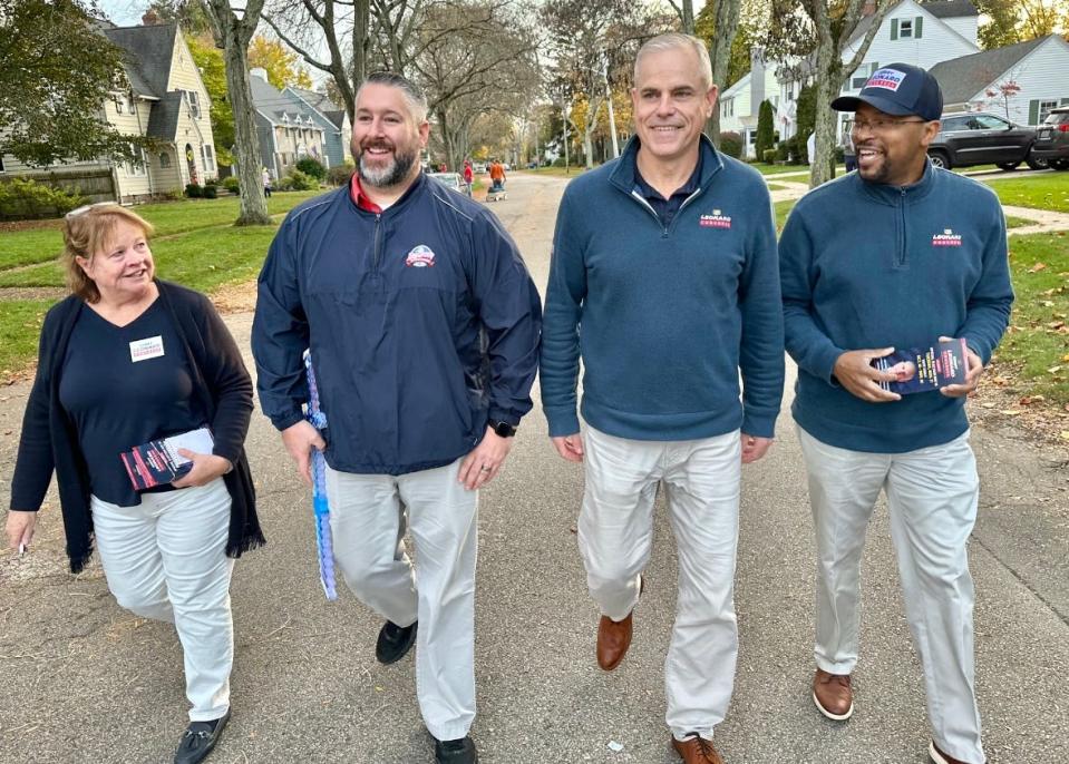 Gerry Leonard, second from right, campaigns in Rumford next to Eddie Wencis, East Providence Republican Committee chair, flanked by Leonard aides Linda Jamison and Mark Garmon.