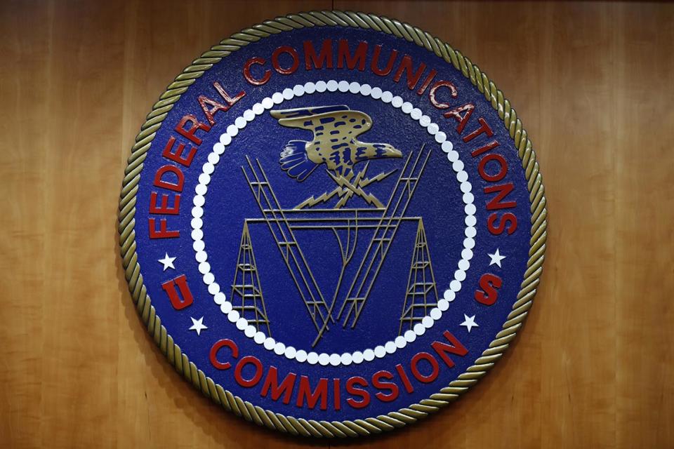 The seal of the Federal Communications Commission (FCC) is seen before an FCC meeting to vote on net neutrality in Washington, Thursday, Dec. 14, 2017. (AP Photo/Jacquelyn Martin)