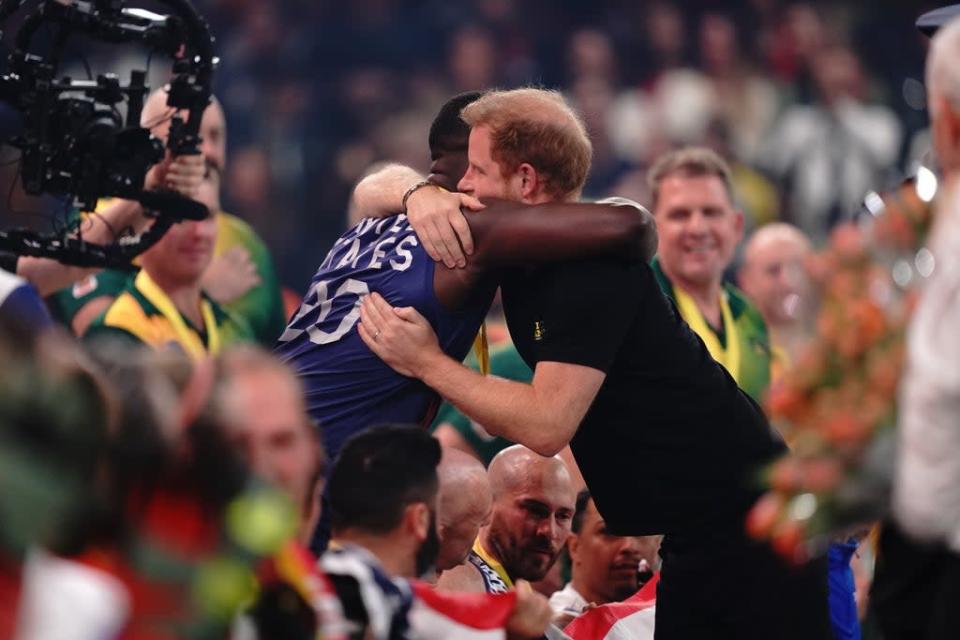 The Duke of Sussex hugs a Team USA player (Aaron Chown/PA) (PA Wire)