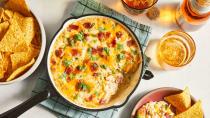<p><strong>Recipe: <a href="https://www.southernliving.com/recipes/jalapeno-popper-dip" rel="nofollow noopener" target="_blank" data-ylk="slk:Jalapeño Popper Dip" class="link ">Jalapeño Popper Dip</a></strong></p> <p>You can bring jalapeño poppers to the party... or you can impress with our dip version. Pickled jalapeños and ultra-rich cheese will be a guaranteed crowd-pleaser scooped up with tortilla chips.</p>