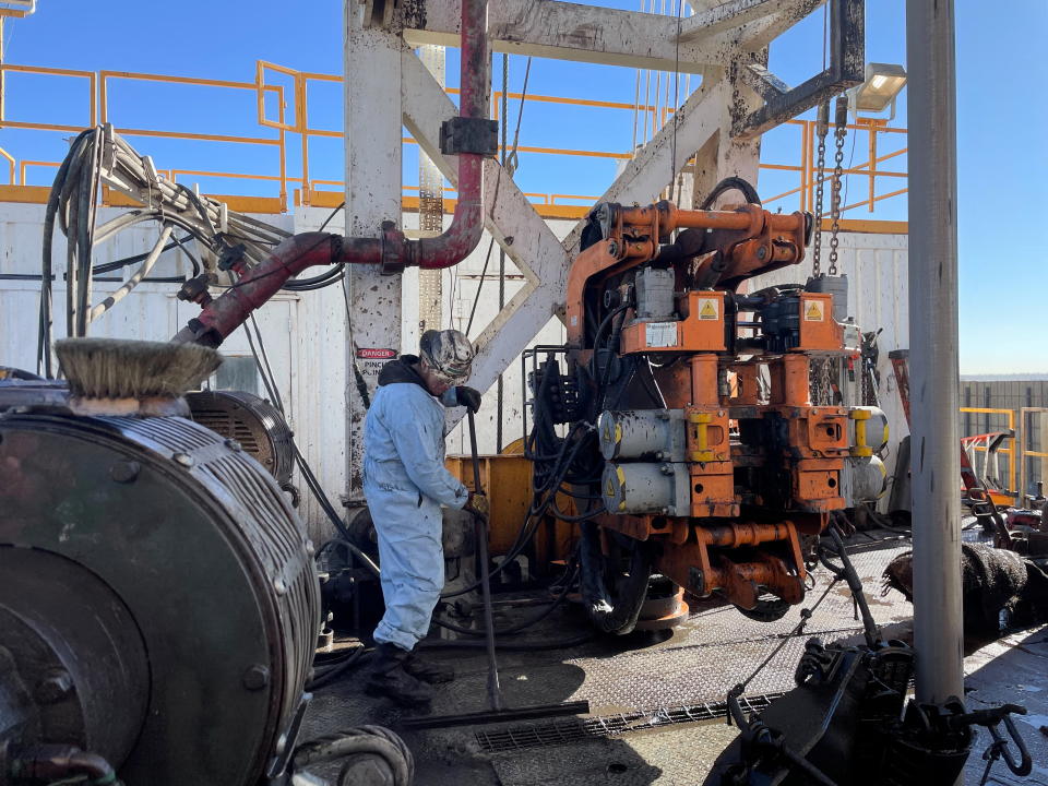 A rig hand works on an electric drilling rig for oil producer Civitas Resources, at the Denver suburbs, in Broomfield, Colorado, U.S, December 2, 2021. Picture taken December 2, 2021. REUTERS/Liz Hampton