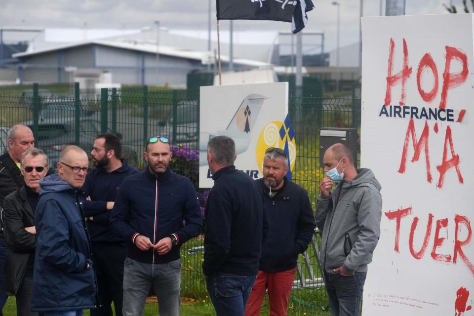 Airline staff members and unionists of the French regional low cost airline, branch of Air France, HOP! demonstrate (AFP via Getty Images)