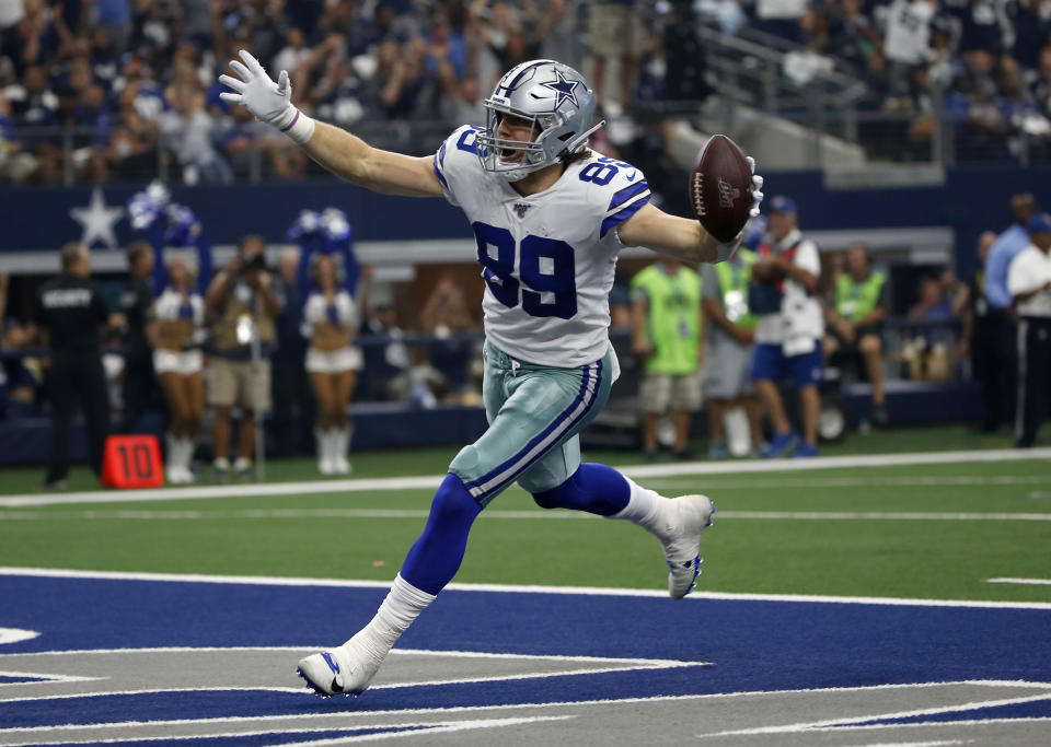 Blake Jarwin celebrates catching a pass for a touchdown.