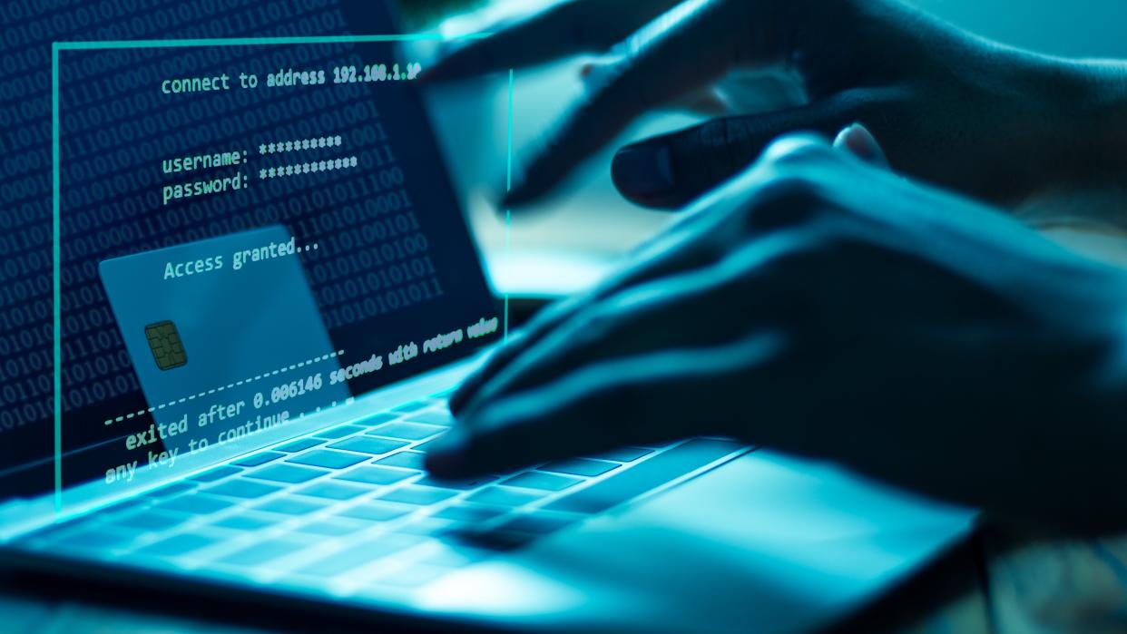  A blue color image of a person trying to log into a protected laptop. 