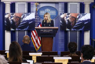 FILE - In this June 1, 2020, file photo, White House press secretary Kayleigh McEnany stands at a podium as video clips of peaceful interactions between law enforcement and protesters demonstrating in response to the death of George Floyd play during a news conference at the White House, in Washington. Reports of hateful and violent speech on Facebook poured in on the night of May 28 after President Donald Trump hit send on a social media post warning that looters who joined protests following Floyd's death last year would be shot, according to internal Facebook documents shared with The Associated Press. (AP Photo/Patrick Semansky, File)