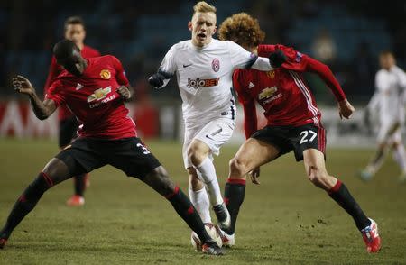 Soccer Football - FC Zorya Luhansk v Manchester United - UEFA Europa League Group Stage - Group A - Chornomorets Stadium, Odessa, Ukraine - 8/12/16 Manchester United's Marouane Fellaini in action with FC Zorya Luhansk's Ivan Petriak Reuters / Valentyn Ogirenko Livepic EDITORIAL USE ONLY.