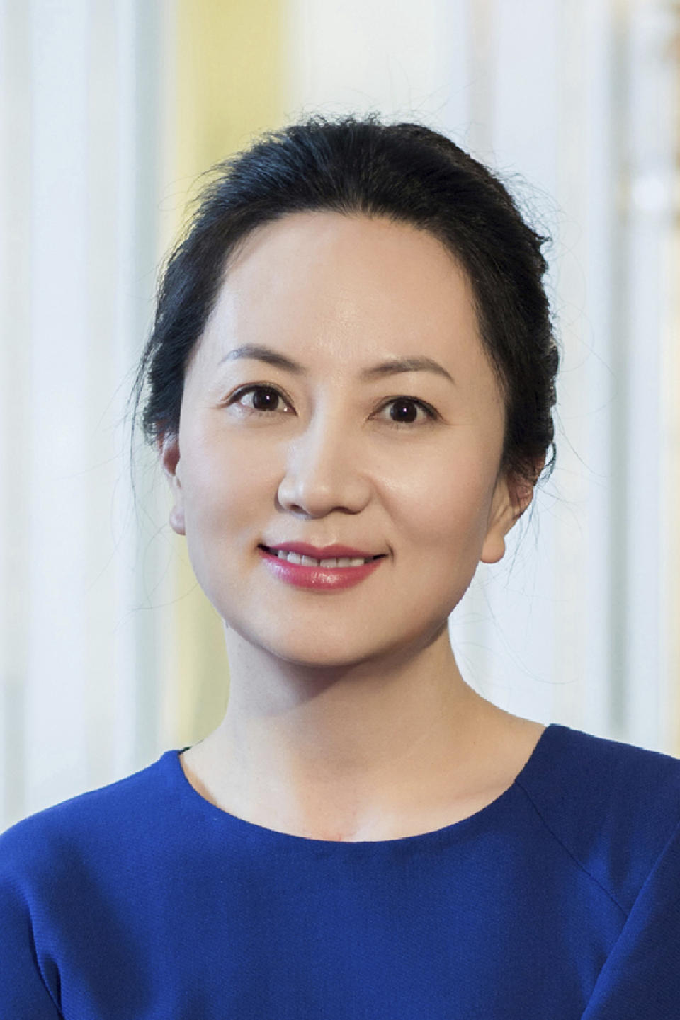 In this undated photo released by Huawei, Huawei's chief financial officer Meng Wanzhou is seen in a portrait photo. China on Thursday, Dec. 6, 2018, demanded Canada release the Huawei Technologies executive who was arrested in a case that adds to technology tensions with Washington and threatens to complicate trade talks. (Huawei via AP)