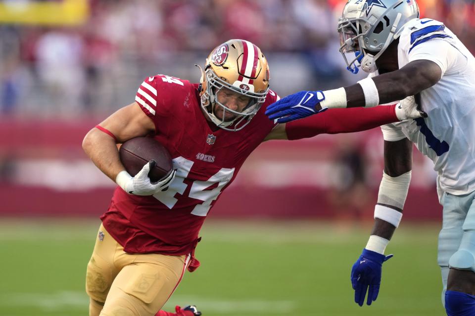 San Francisco 49ers fullback Kyle Juszczyk (44) runs after a catch against Dallas Cowboys safety Jayron Kearse (1) on Oct. 8 in Santa Clara, Calif.